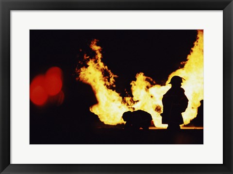 Framed Firefighters In front Of Flames Extinguishing A Fire Print