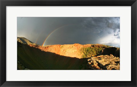 Framed Crater of an extinct volcano with a rainbow in the sky Print