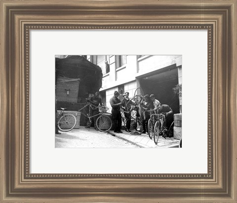 Framed Taking care of  maintenance of the racing bicycles during a rest day in Belfort Print