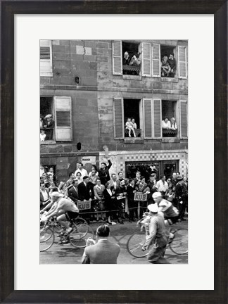 Framed People watching the cyclists being provisioned. Tour de France 1958. Print