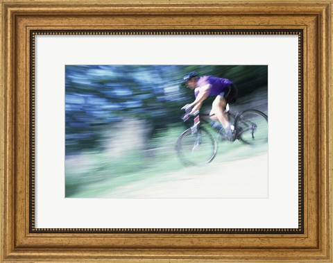 Framed Side profile of a young man riding a bicycle Print