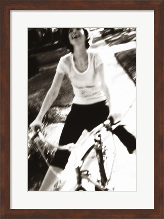 Framed Young woman riding a bicycle - black &amp; white Print