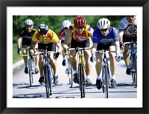 Framed Group of cyclists riding bicycles Print