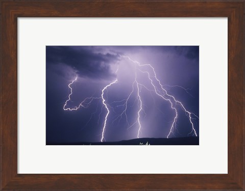 Framed Lightning bolts striking the earth Print