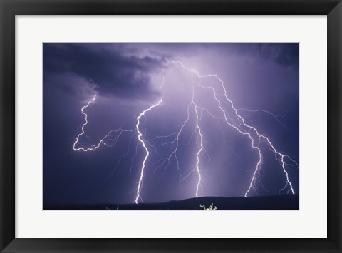 Framed Lightning bolts striking the earth Print