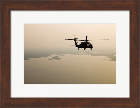 Framed Air Force helicopter flys over Lake Pontchatrain to New Orleans Print