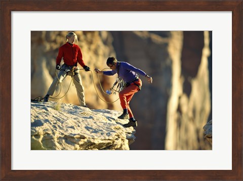 Framed Two hikers with ropes at the edge of a cliff Print