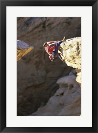 Framed High Angle View of a Man hanging off of a Summit Print