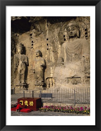 Framed Buddha Statue in a Cave, Longmen Caves, Luoyang, China with Flowers Print