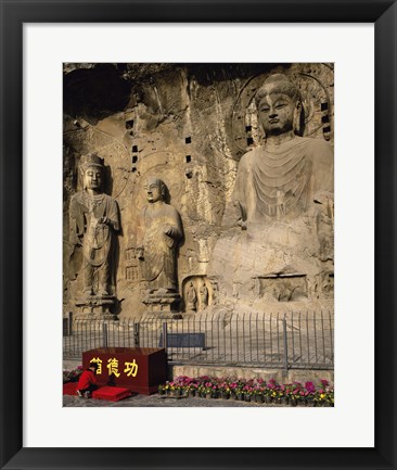 Framed Buddha Statue in a Cave, Longmen Caves, Luoyang, China with Flowers Print