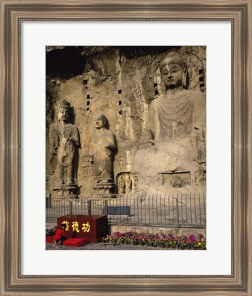 Framed Buddha Statue in a Cave, Longmen Caves, Luoyang, China with Flowers Print