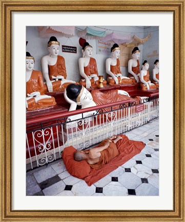 Framed Monk Sleeping in Front of Buddha Statues Print