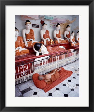 Framed Monk Sleeping in Front of Buddha Statues Print