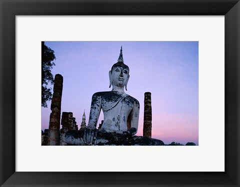 Framed Low angle view of the Seated Buddha, Wat Mahathat, Sukhothai, Thailand Print