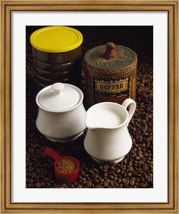Framed Close-up of a mug of milk with a measuring spoon and jars on coffee beans Print