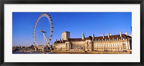 Framed Ferris wheel with buildings at the waterfront, River Thames, Millennium Wheel, London County Hall, London, England Print