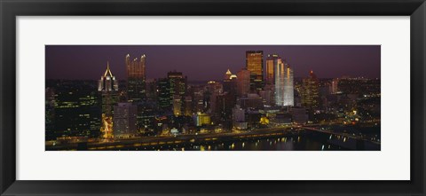 Framed High angle view of buildings lit up at night, Pittsburgh, Pennsylvania, USA Print