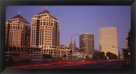 Framed USA, California, Oakland, Alameda County, New City Center, Buildings lit up at night Print