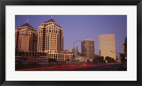 Framed USA, California, Oakland, Alameda County, New City Center, Buildings lit up at night Print