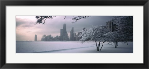 Framed Snow covered tree on the beach with a city in the background, North Avenue Beach, Chicago, Illinois, USA Print