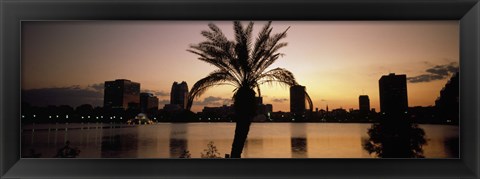 Framed Silhouette of buildings at the waterfront, Lake Eola, Summerlin Park, Orlando, Orange County, Florida, USA Print