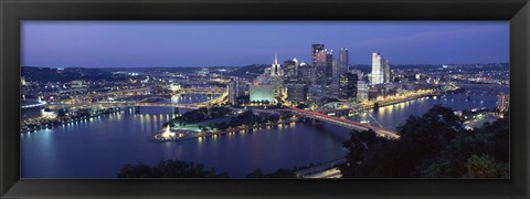 Framed Buildings along a river lit up at dusk, Monongahela River, Pittsburgh, Allegheny County, Pennsylvania, USA Print