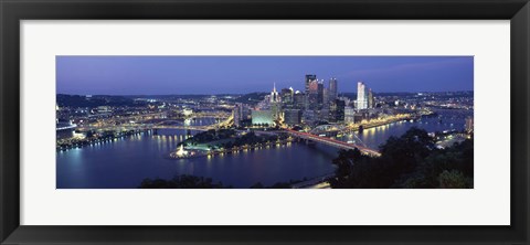 Framed Buildings along a river lit up at dusk, Monongahela River, Pittsburgh, Allegheny County, Pennsylvania, USA Print