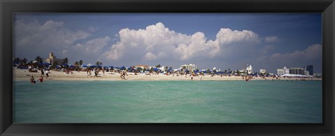 Framed Tourists on the beach, Miami, Florida, USA Print