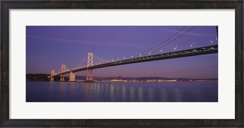 Framed Low angle view of a bridge at dusk, Oakland Bay Bridge, San Francisco, California, USA Print