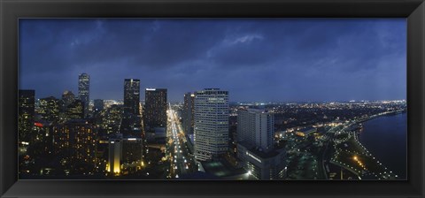 Framed High angle view of buildings in a city lit up at night, New Orleans, Louisiana, USA Print