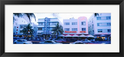 Framed Traffic on road in front of hotels, Ocean Drive, Miami, Florida, USA Print