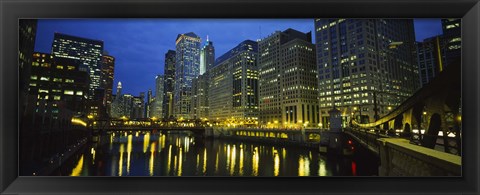 Framed Low angle view of buildings lit up at night, Chicago River, Chicago, Illinois, USA Print