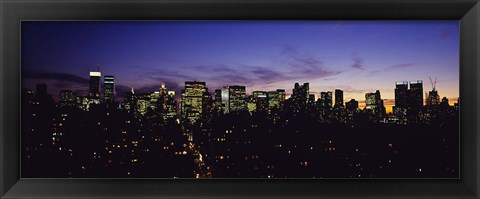 Framed Skyscrapers in a city lit up at night, Manhattan, New York City, New York State, USA Print