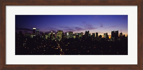 Framed Skyscrapers in a city lit up at night, Manhattan, New York City, New York State, USA Print