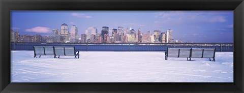 Framed Park benches in snow with a city in the background, Lower Manhattan, Manhattan, New York City, New York State, USA Print