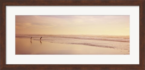 Framed Two children playing on the beach, San Francisco, California, USA Print