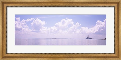 Framed Sea with a container ship and a suspension bridge in distant, Sunshine Skyway Bridge, Tampa Bay, Gulf of Mexico, Florida, USA Print