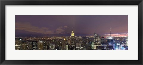 Framed Buildings in a city lit up at dusk, Midtown Manhattan, Manhattan, New York City, New York State, USA Print