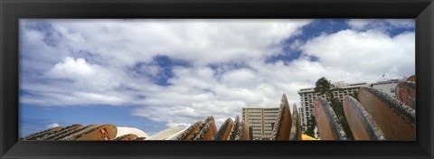 Framed Low angle view of skyscrapers and surfboards, Honolulu, Oahu, Hawaii, USA Print