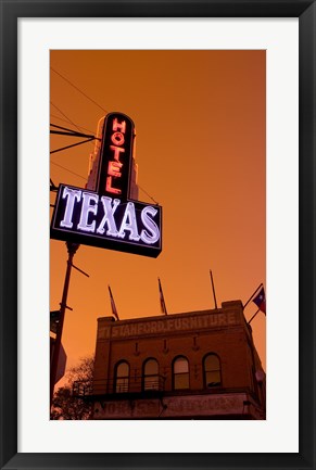 Framed Low angle view of a neon sign of a hotel lit up at dusk, Fort Worth Stockyards, Fort Worth, Texas, USA Print