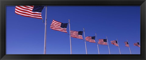 Framed Low angle view of American flags, Washington Monument, Washington DC, USA Print