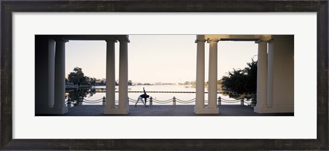Framed Person stretching near colonnade, Lake Merritt, Oakland, Alameda County, California, USA Print