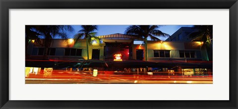 Framed Traffic in front of a building at dusk, Art Deco District, South Beach, Miami Beach, Miami-Dade County, Florida, USA Print