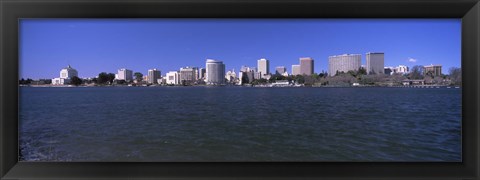 Framed Skyscrapers along a lake, Lake Merritt, Oakland, California, USA Print