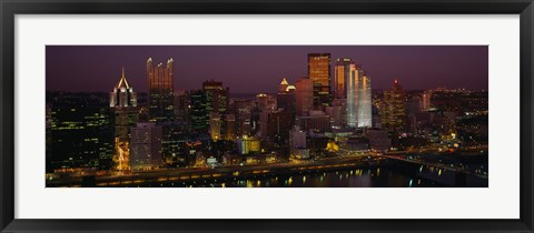 Framed High angle view of buildings lit up at night, Pittsburgh, Pennsylvania, USA Print