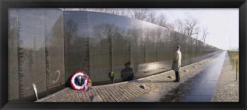 Framed Side profile of a person standing in front of a war memorial, Vietnam Veterans Memorial, Washington DC, USA Print