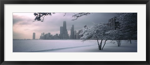 Framed Snow covered tree on the beach with a city in the background, North Avenue Beach, Chicago, Illinois, USA Print