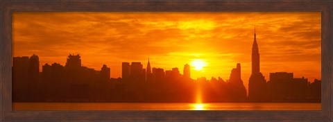 Framed Birght Orange Sky and Sun Behind the New York City Skyline Print