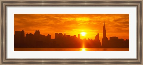 Framed Birght Orange Sky and Sun Behind the New York City Skyline Print