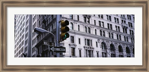 Framed Low angle view of a Green traffic light in front of a building, Wall Street, New York City Print